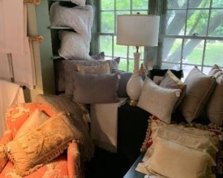A selection of antique white linen and lace pillows