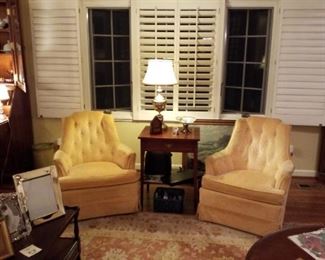 Matching pair of yellow velour upholstered armchairs,  mahogany side table with drawer, brass table lamp, DVD Blue-Ray player, sound speaker, mahogany coffee table on brass wheels with 2 storage drawers