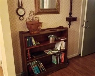 Mahogany bookcase, smaller Airguide barometer by Fee & Stemwedel-mahogany, mahogany letter slotted with copper planter, rectangular wall mirror,  cast iron door stops