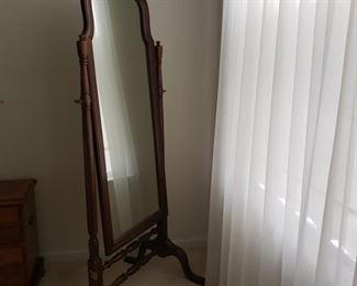 64" tall x 27" wide x 23 deep (at foot of mirror). Frame needs to be tightened up.