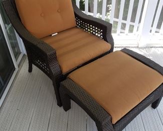Resin Patio chair and ottoman with cushions. When measured together...50" long x 27.5" wide x 30" high. Some fading in cushions.
