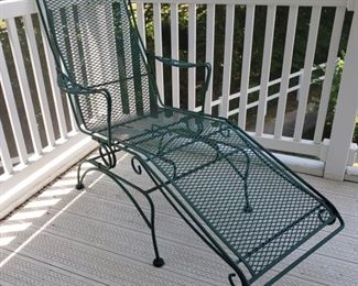 Green iron "rocking" lounge chair with dogwood pattern. 60" long x 26" w x 41" high.
