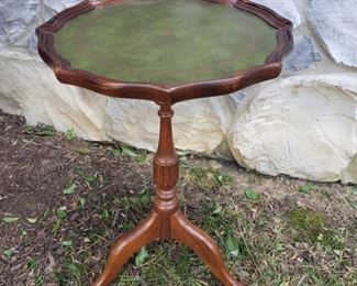 Green leather top side table. 12.5" diameter x 20" high.