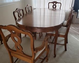 Dining Room table and chairs. Six chairs, two with arms. Table with one leaf 73" long x 41" wide x 29" high. Chairs measure approximately 37" high x 20" deep x 23 wide.