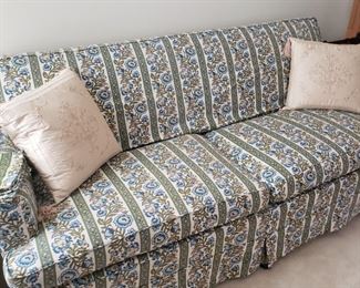 Floral upholstered couch. Some signs of wear due to regular use. 34" deep x 32" high x 74" wide.