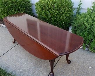 Double drop-side coffee table. 52" long x 18" high x 34" with table sides extended.