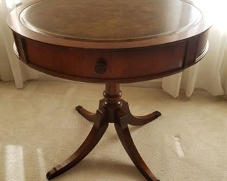 Leather top round table. 29" diameter x 27.5" high.