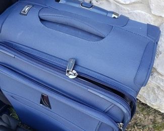 Blue Roll-on Delsey Lightweight suitcase.14.5" x 10x x 20"