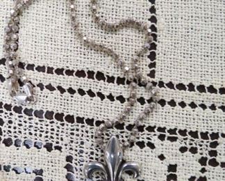 Sterling silver fleur de lis pendant necklace.
