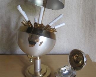 Vintage globe cigarette holder and matching lighter.