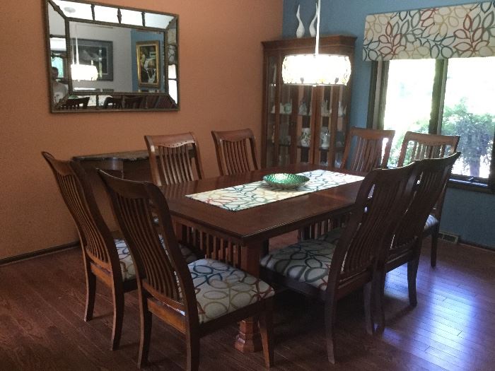 Very well made prairie style dining room set. Measures 72 inches long. Includes a 12 inch leaf and 8 chairs custom made runner included with set. 