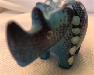 Brighter Blue in person on this little African Rhino Stone Carving