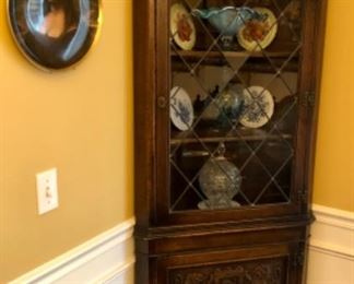 Ornate oak corner cabinet. Art glass