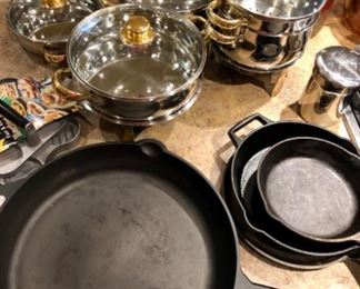 Cast Iron skillets (Lodge, 15" Amazon Basics skillet), stainless pots & pans