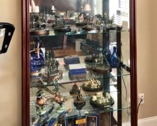 Large lighted curio with sliding front door with lock