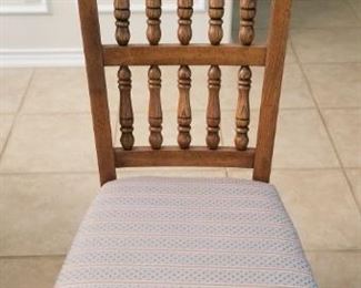 One of 6 pressed back Oak chairs