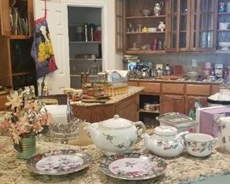 Several tea pots, cups and more