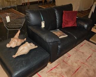 Leather three-place sofa and matching ottoman