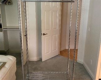 Chrome wardrobe rack on wheels with cloth cover as seen in next picture 