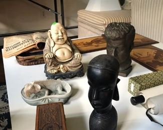 a JFK clay head, a nice buddha and an African ironwood sculpted head which is one of the show's stars