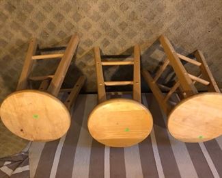 three upside down stools
