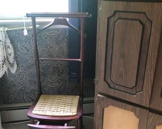 dresssing chair next to cabinet