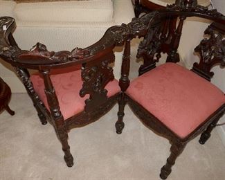 Tete a' Tete highly carved chair