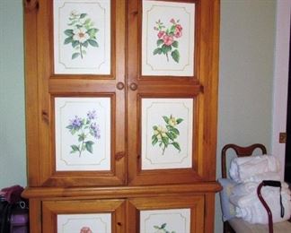 STORAGE CABINET WITH FLORAL INSETS  $200.00