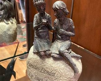 "Families Bonded by Tears and Laughter" sculpture