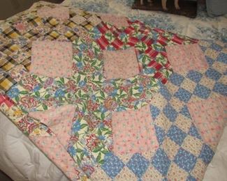 Hand quilted quilt made with feed sack material