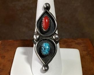 #6...Signed size 7 Native American made double teardrop shaped silver ring. Turquoise and coral cabochons stand out well against a black patina background. Finished with four giant silver rain drops on the top, bottom and in the center. Signed XZR. $180