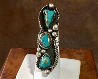 #11...Gorgeous size 5 3/4 old pawn silver ring featuring three turquoise cabochons, eight large rain drops and very unusual, beautiful edging of raised silver feather shapes on top left and bottom right. Split shank band. $230