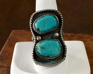 #19...Great size 9 1/4 old pawn Native American made silver ring. Two oval shaped turquoise cabochons set in smooth bezels pop against a black patina background. Finished with two rain drops and twisted silver wire frame. Split shank band. $200