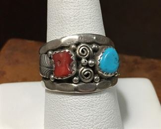 #21...Gorgeous size 8 1/4 Native American made sterling silver wide band ring. Features turquoise and coral cabochons set in sawtooth bezels. Silver decorations include two leaves and twelve rain drops. Stamped Sterling. $240