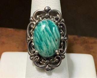 #27...Signed Size 7 Thai sterling silver and BEAUTIFUL green and white striped gemstone (amazonite?) ring. Large cabochon is prong set and surrounded by a lovely curly scroll design frame. Solid silver band. Signed NK, stamped 925 THAILAND. $160