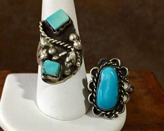 #45...Native American silver rings: (1) Size 7 1/2 old pawn ring with two cube-shaped turquoise cabochons and split shank band. $130 (2) Size 4 3/4 ring with oval turquoise cabochon with silver scalloped outer edges. $130