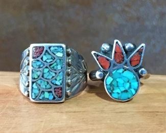#47...Native American silver rings: (1) Size 7 3/4 solid rectangular-shaped size 7 3/4 turquoise and coral chip inlay ring with stamped band. $150; (2) Size 6 crowned head-shaped turquoise and coral chip inlay ring with solid band. $120