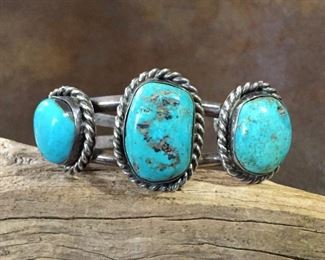 #51...Stunning old pawn silver cuff bracelet with three big chunky turquoise cabochons. Each gorgeous cabochon is set in a smooth bezel then framed in super thick twisted rope style silver wire. Total circ. 6 1/4" (5 1/4" inner circ. with 1" gap). Slightly flexible. $650
