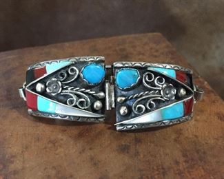 #59...Signed sterling silver inlay watch tips with coral, turquoise, onyx and mother of pearl, signed JM, stamped STERLING. Size 7/8" x 1 1/4". Would make fabulous earrings. $150