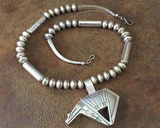 #8...FABULOUS 27" long all Sterling silver Navajo pearl and cylindrical barrel bead necklace with HUGE Sterling bear pendant. Bear is 3" x 2 3/4", including hinged bale. Signed Jose N and stamped STERLING. Necklace has 26 15mm bench-made Navajo beads and four 1 1/2" long 10mm barrel beads, and is finished with 4-sided cones and thick hook & eye clasp. $1185