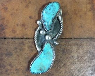 #70...Native American made old pawn pendant with two large turquoise cabochons, four large sterling silver rain drops and rope-style wire decoration on each side. Hidden bale in top center on back. Size 2 1/4" x 3/4". $220