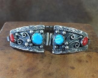 #88...Signed sterling silver watch tips with coral and turquoise, signed JM, stamped STERLING, size 3/4" x 1 1/8". Decorated with raindrops and stamped edges. $120