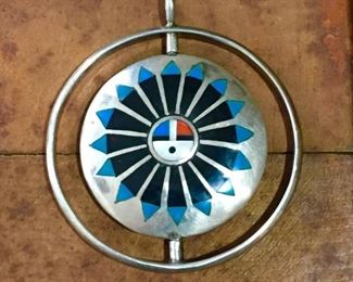 #55...Stunning large Zuni sterling silver inlay 2-sided spinner pendant of the very highest quality and craftsmanship. Zuni sun god on one side (mother of pearl, turquoise, coral & onyx inlay) and rainbow man kachina dancer on the other side (see next photo). Signed JM & stamped STERLING HANDCRAFTED. Size 2 1/4" x 2 1/2" (including bale). $550