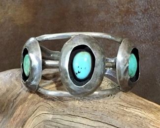 #90...Native American handmade old pawn sterling silver and turquoise cuff bracelet. Features three gorgeous turquoise cabochons set in shadowbox settings. Total circ. 7 1/2" (6 1/4" inner circ. with 1 1/4" gap). Size of framed center cabochon is 1 1/4" x 1 5/8". Not flexible. $650
