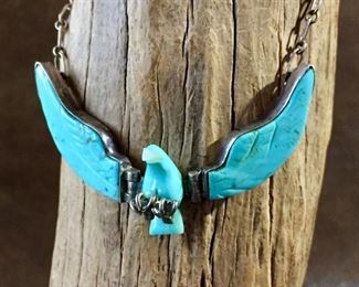 #99...Sterling silver and carved turquoise eagle pendant with carved mother of pearl beak (see close-up in next photo), hinged moving wings and sterling talons. Pendant is 2 1/4" x 1 1/4", signed W and stamped Sterling, clasp stamped 925. Total necklace length 17". $280