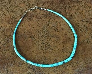 #102...Very short necklace with turquoise heishi beads, sterling silver beads and hook and eye clasp. Length is 14 1/4". $90