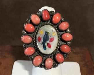 #4...Stunning large vintage Native American ring size 8, comprised of coral cabochons surrounding a cardinal inlay in mother-of-pearl center set in sterling silver. Face of ring is 1 1/4" w x 1 1/2" tall. Signed with a mark that looks like a conjoined T and H. $650