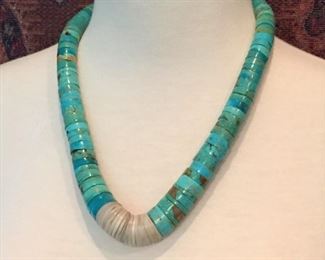 #3...Thick chunky 22" long museum-quality vintage Santo Domingo necklace with shell heishi and graduated turquoise heishi beads. Finished with two old coral beads and a hook and eye clasp. Strung on string. This is totally awesome.
$1200