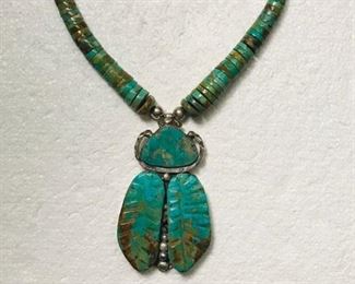 #75...Absolutely AMAZING 4" tall and 2.5" wide turquoise bug pendant on 24" turquoise heishi. Very old, primitive, and should be in a museum, but is perfectly wearable. It has been restrung on silver cable at some point for extra flexibility and durability, as it is a heavy piece. Turquoise colors are visually stunning on this magnificent showstopper. $2800