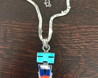 Signed piece from the eighties by Navajo artist BURT GEORGE. Turquoise, Lapis, Coral, and other stone inlay. Pendant part is 2 5/8" tall including bale. One of a kind! $545